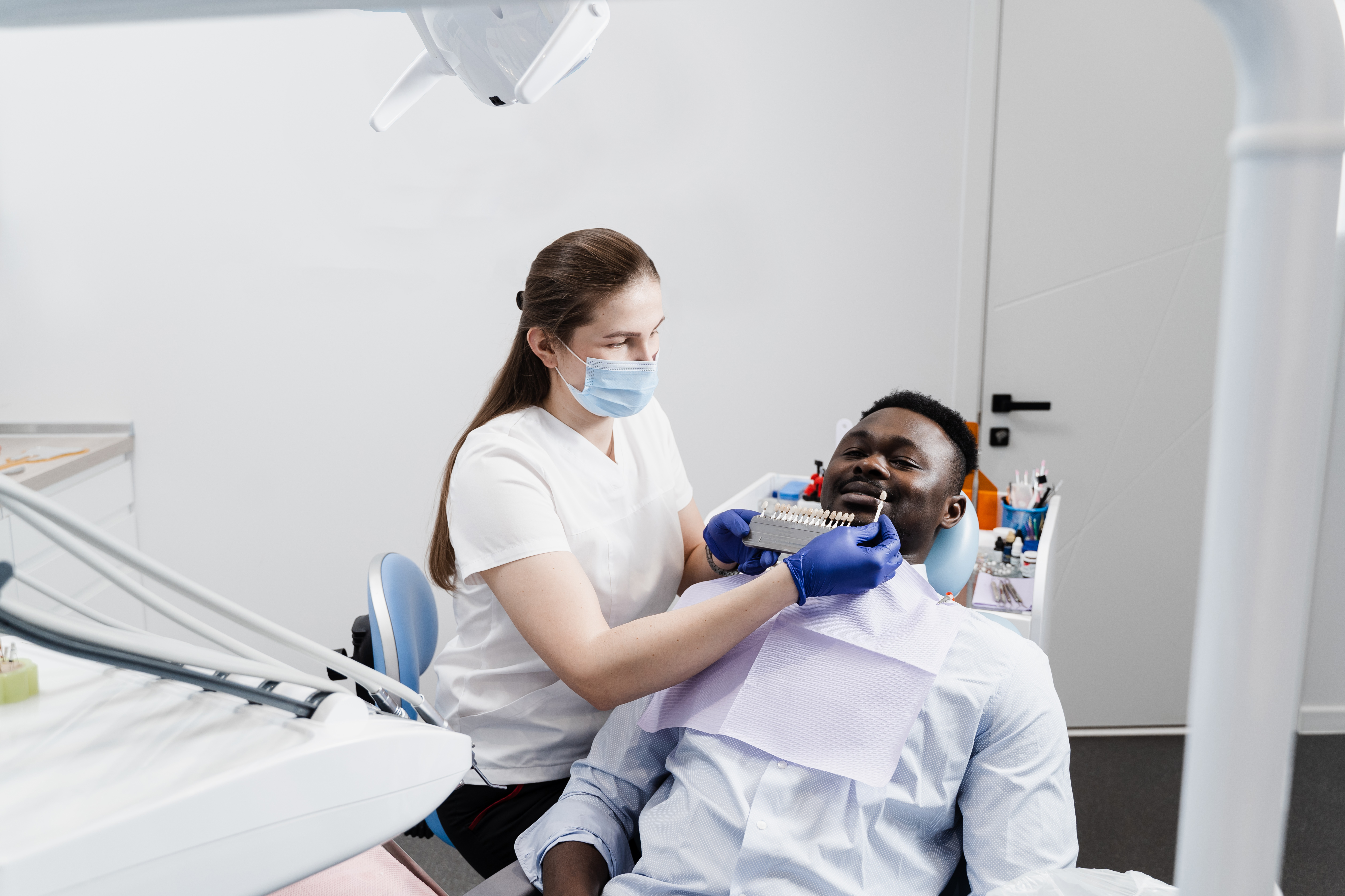 Dental consultation — dentist and patient at clinic